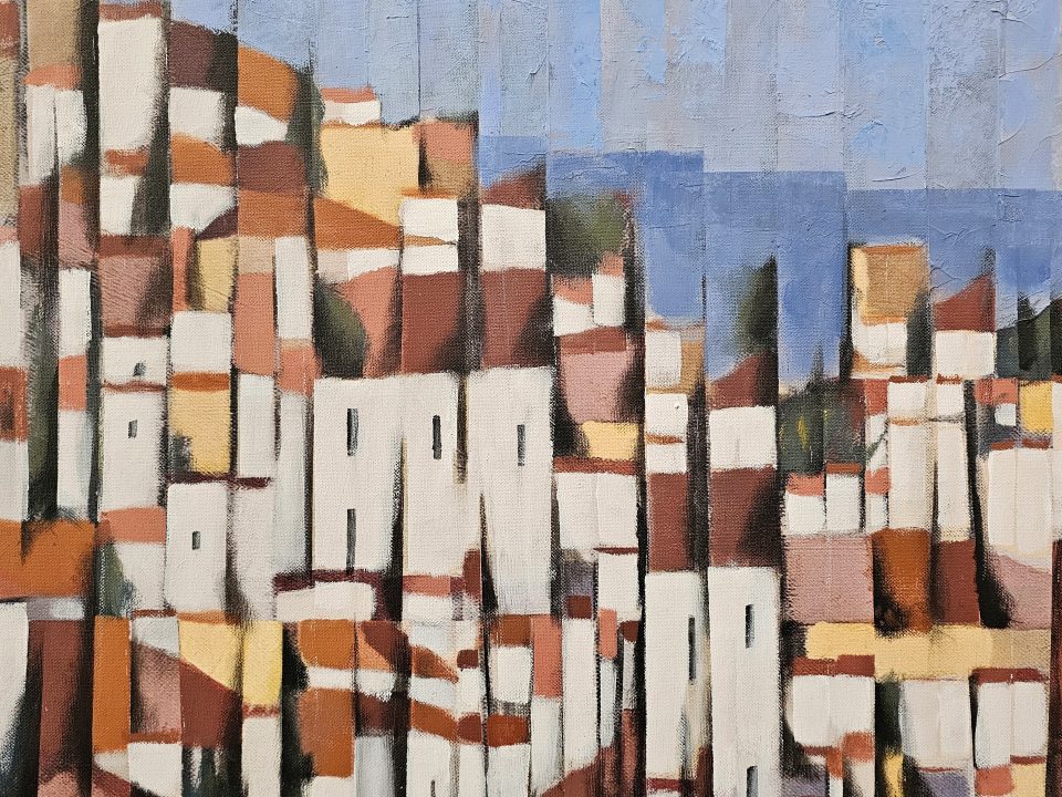 Casario branco com telhados vermelhos numa colina de Lisboa, sob um céu azul — A Colina Aprende a Olhar, de Rui Carruço.